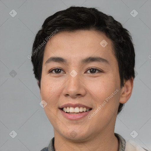 Joyful asian young-adult male with short  black hair and brown eyes