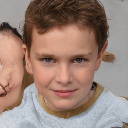 Joyful white child male with short  brown hair and brown eyes