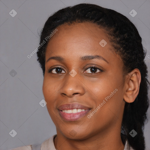 Joyful black young-adult female with medium  black hair and brown eyes