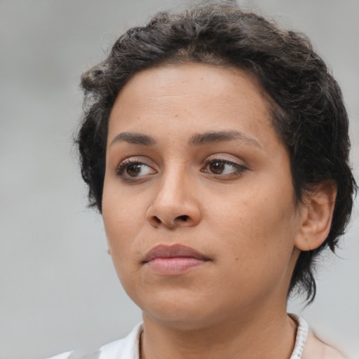 Neutral latino young-adult female with short  brown hair and brown eyes