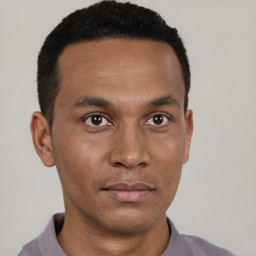 Neutral black young-adult male with short  black hair and brown eyes