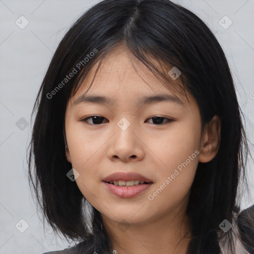 Joyful asian young-adult female with medium  black hair and brown eyes