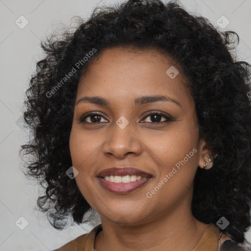 Joyful black young-adult female with long  brown hair and brown eyes