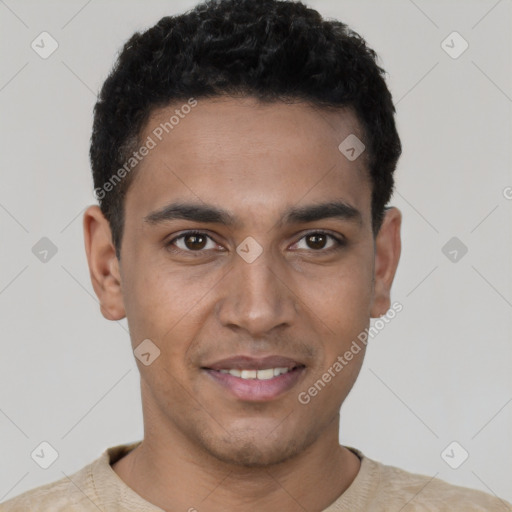 Joyful latino young-adult male with short  black hair and brown eyes