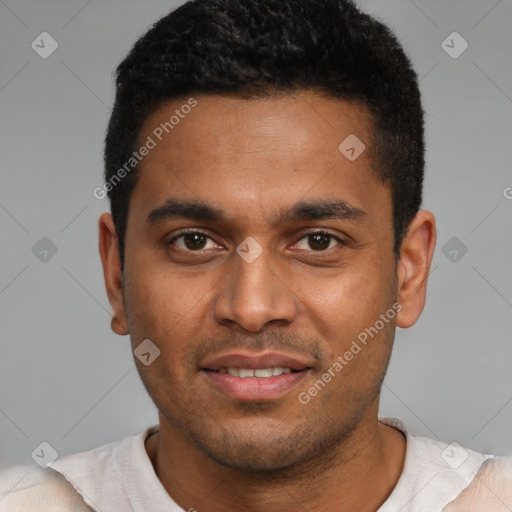 Joyful black young-adult male with short  black hair and brown eyes