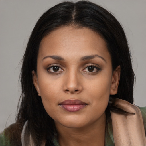 Joyful asian young-adult female with long  brown hair and brown eyes