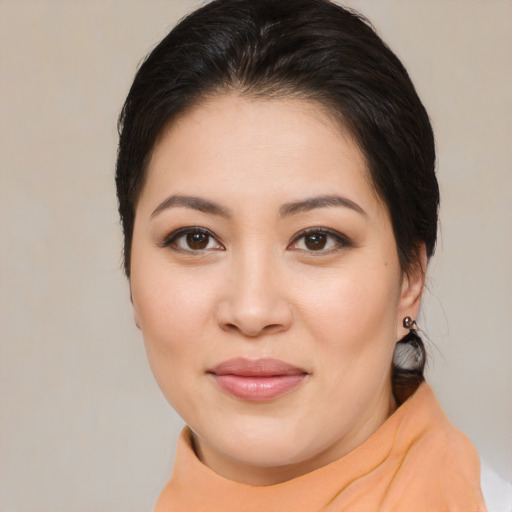 Joyful asian young-adult female with medium  brown hair and brown eyes