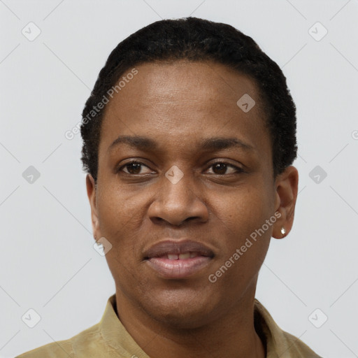 Joyful black young-adult female with short  black hair and brown eyes