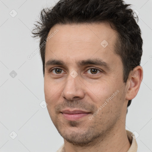 Joyful white adult male with short  brown hair and brown eyes