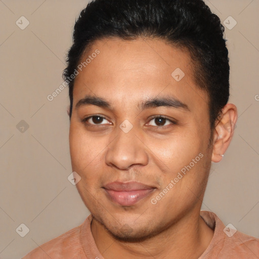 Joyful latino young-adult male with short  brown hair and brown eyes