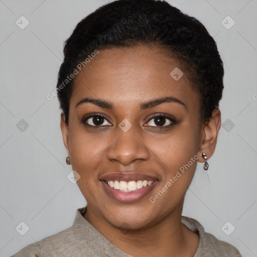 Joyful black young-adult female with short  black hair and brown eyes