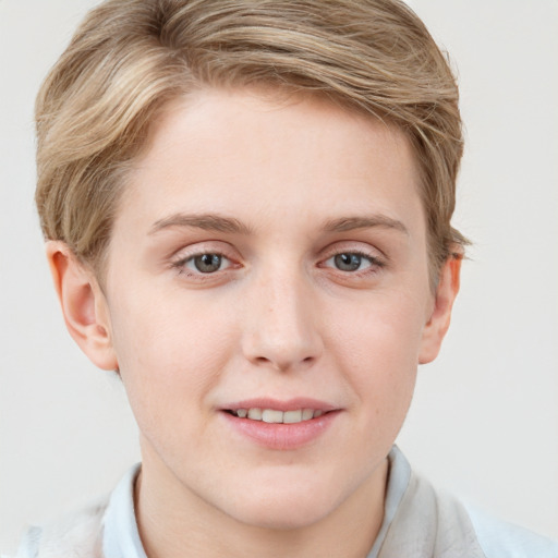 Joyful white young-adult female with short  brown hair and blue eyes