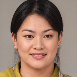 Joyful white young-adult female with medium  brown hair and brown eyes