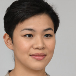 Joyful asian young-adult female with short  brown hair and brown eyes