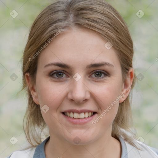 Joyful white young-adult female with medium  brown hair and blue eyes