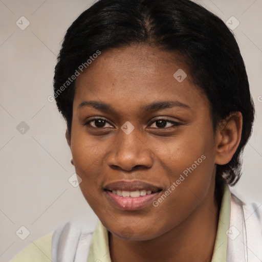 Joyful black young-adult female with short  black hair and brown eyes