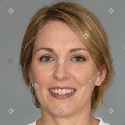 Joyful white adult female with medium  brown hair and blue eyes