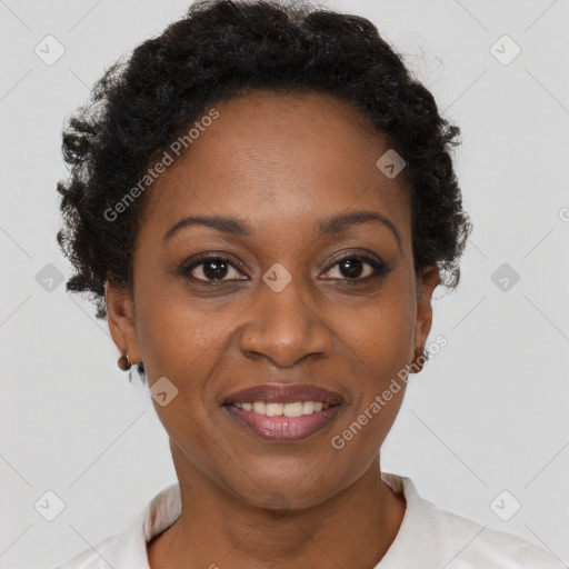 Joyful black adult female with short  brown hair and brown eyes