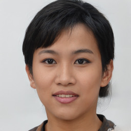 Joyful asian young-adult female with medium  black hair and brown eyes