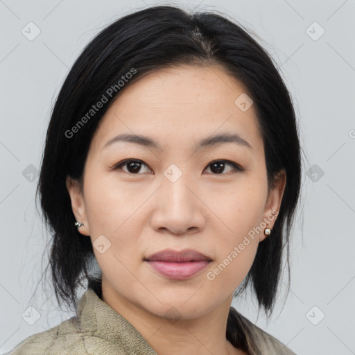Joyful asian young-adult female with medium  black hair and brown eyes