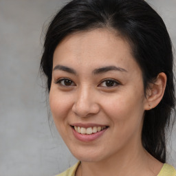 Joyful asian young-adult female with medium  brown hair and brown eyes