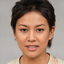 Joyful asian young-adult female with short  brown hair and brown eyes