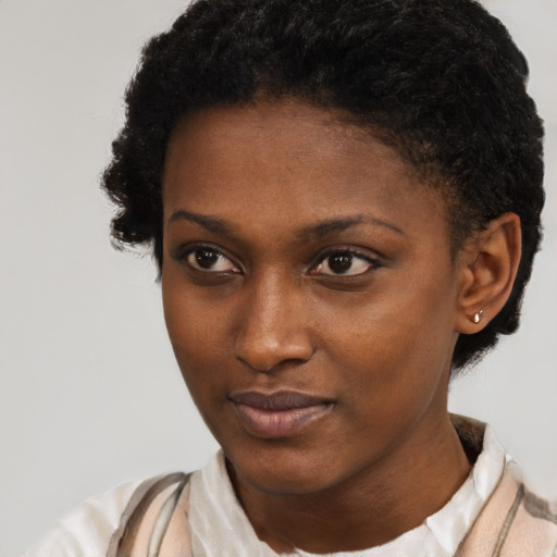 Neutral black young-adult female with short  brown hair and brown eyes