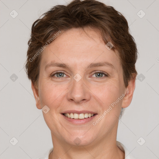 Joyful white adult female with short  brown hair and grey eyes