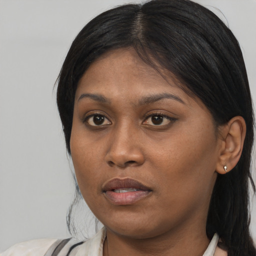 Neutral asian young-adult female with medium  brown hair and brown eyes