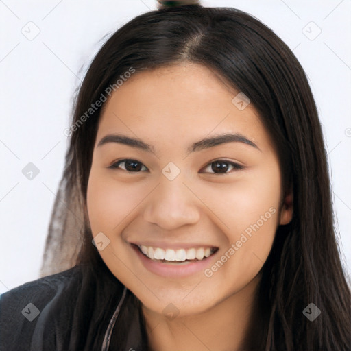 Joyful latino young-adult female with long  brown hair and brown eyes