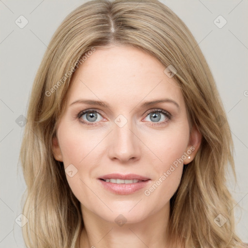 Joyful white young-adult female with long  brown hair and blue eyes