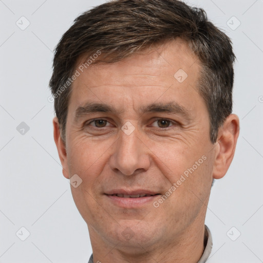 Joyful white adult male with short  brown hair and brown eyes