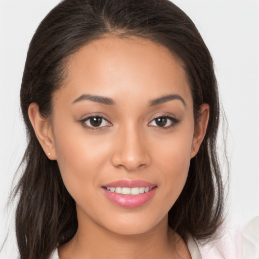 Joyful white young-adult female with long  brown hair and brown eyes