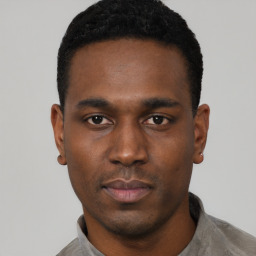 Neutral black young-adult male with short  black hair and brown eyes