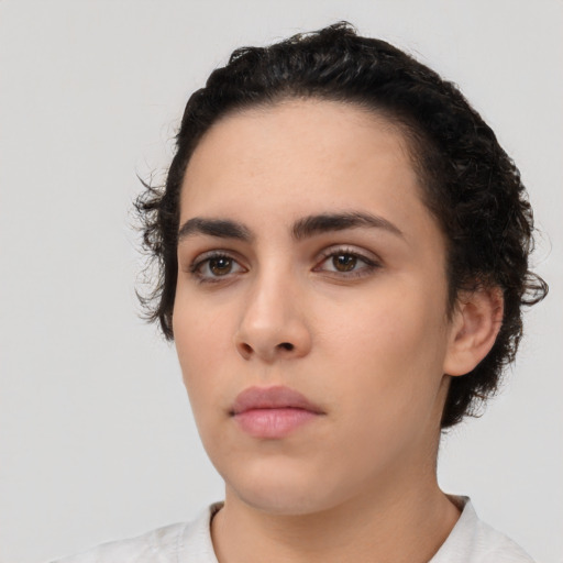 Neutral white young-adult female with short  black hair and brown eyes