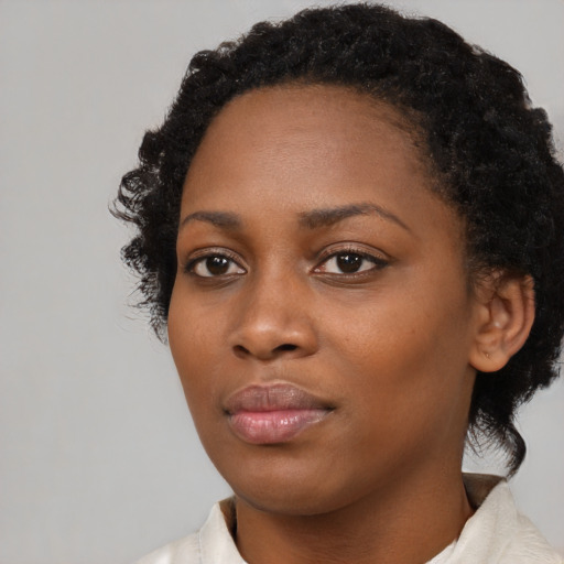 Neutral black young-adult female with medium  black hair and brown eyes