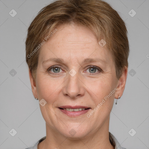 Joyful white adult female with short  brown hair and grey eyes