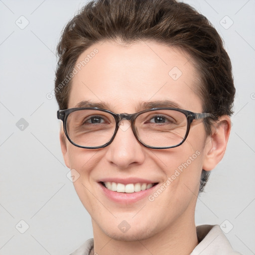 Joyful white young-adult female with short  brown hair and blue eyes