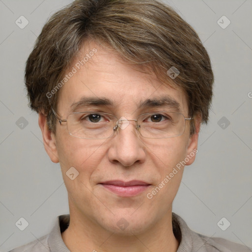 Joyful white adult male with short  brown hair and grey eyes