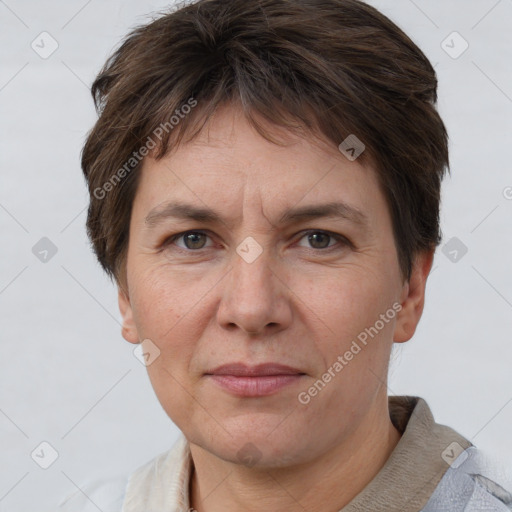 Joyful white adult female with short  brown hair and grey eyes