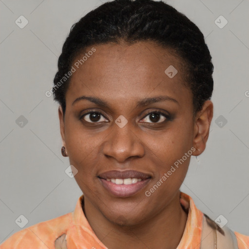 Joyful black young-adult female with short  brown hair and brown eyes