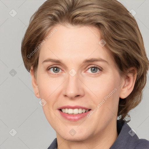 Joyful white adult female with short  brown hair and grey eyes