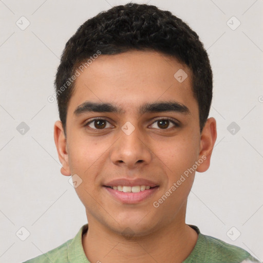 Joyful latino young-adult male with short  brown hair and brown eyes