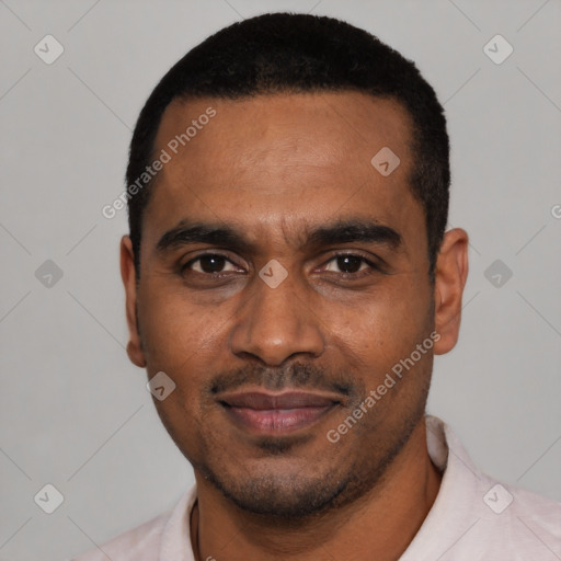 Joyful black young-adult male with short  black hair and brown eyes