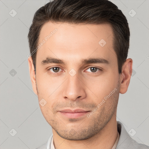 Neutral white young-adult male with short  brown hair and brown eyes