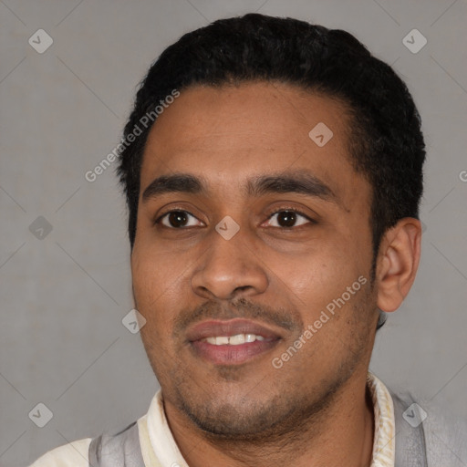 Joyful latino young-adult male with short  black hair and brown eyes