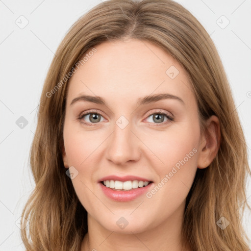 Joyful white young-adult female with long  brown hair and green eyes