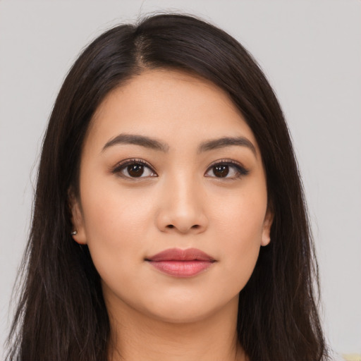Neutral latino young-adult female with long  brown hair and brown eyes