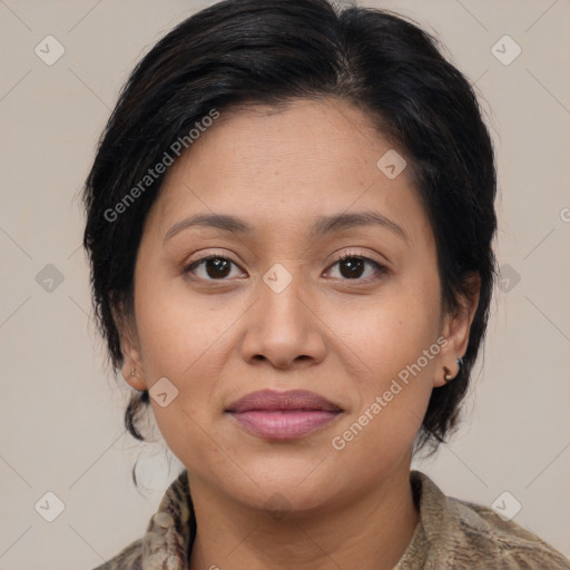 Joyful latino young-adult female with medium  brown hair and brown eyes