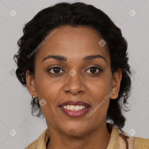 Joyful black adult female with medium  brown hair and brown eyes